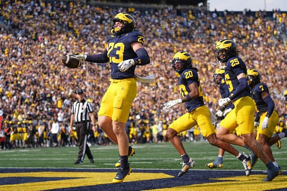 Cole Sullivan (23), Jyaire Hill (20), Mason Curtis (25), and TJ Metcalf (7)