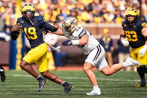 Bryce Underwood (19) and Jake Guarnera (53)