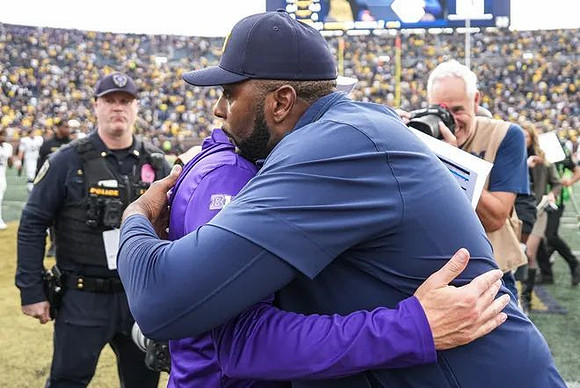 Washington Head Coach Jedd Fisch  and Sherrone Moore