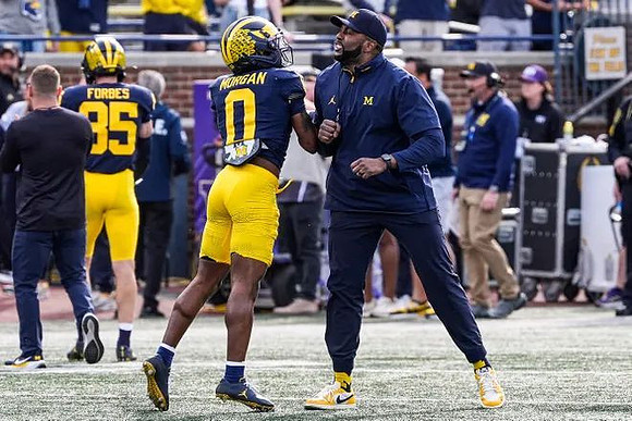Logan Forbes (85), Semaj Morgan (0), and Sherrone Moore