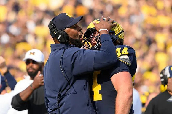 Sherrone Moore and Max Bredeson (44)
