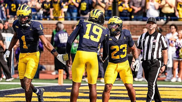 Donaven McCulley (1), Bryce Underwood (19), and Jordan Marshall (23)