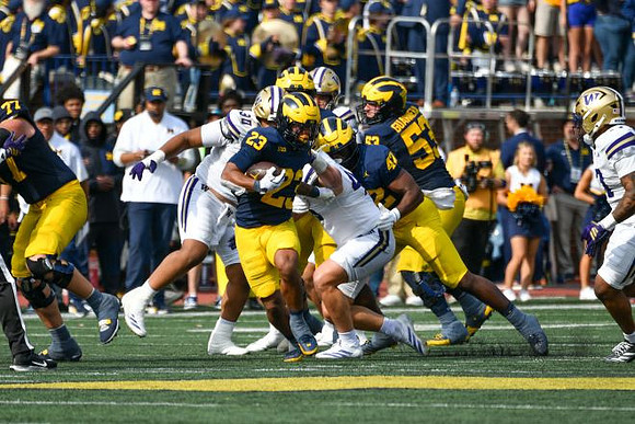 Blake Frazier (77), Jordan Marshall (23), Jalen Hoffman (42), and Jake Guarnera (53)