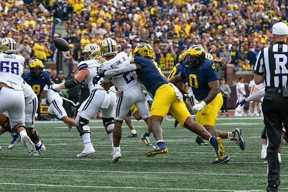 Cameron Brandt (9), Derrick Moore (8), and Tré Williams (0)