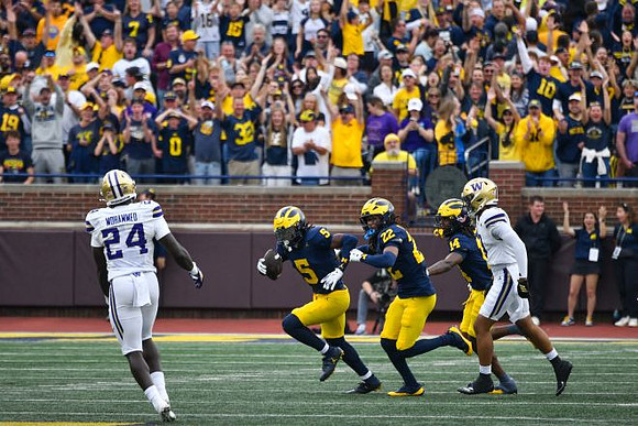Jacob Oden (5), Elijah Dotson (22), and Jordan Young (14)