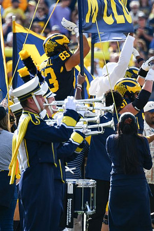 Zack Marshall (83) and Michigan Band
