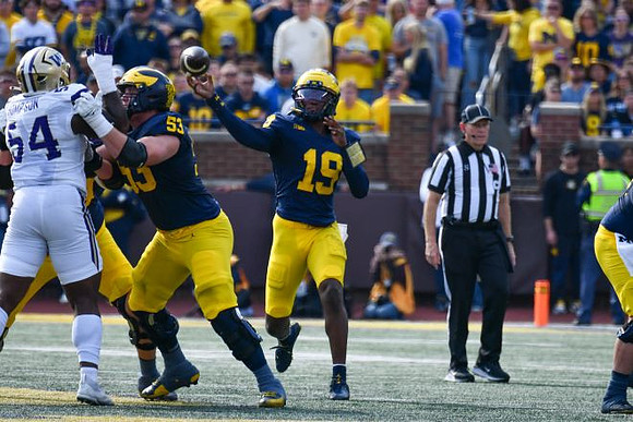 Jake Guarnera (53) and Bryce Underwood (19)