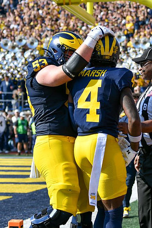 Jake Guarnera (53) and Andrew Marsh (4)