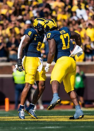 Derrick Moore (8) and Enow Etta (17)