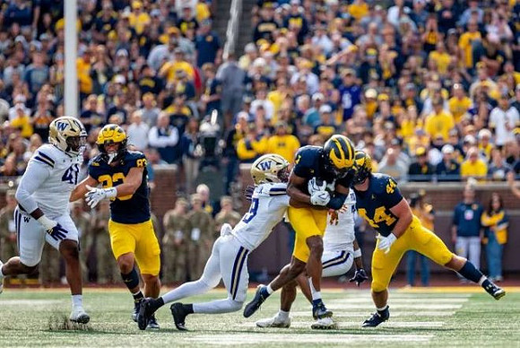 Zack Marshall (83), Donaven McCulley (1), and Max Bredeson (44)