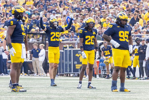 Cameron Brandt (9), Mason Curtis (25), Jyaire Hill (20), and Trey Pierce (95)