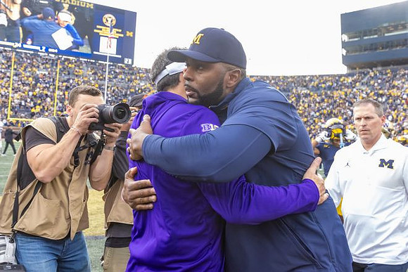 Washington Head Coach Jedd Fisch  and Sherrone Moore
