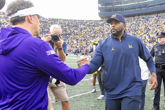 Washington Head Coach Jedd Fisch  and Sherrone Moore