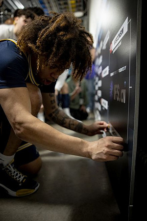 Tre Donaldson (3) and Michigan Team