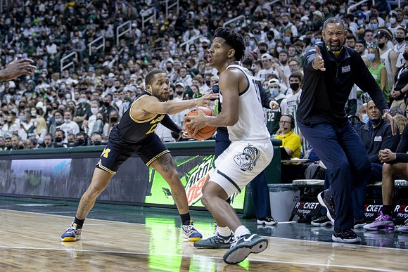 DeVante' Jones (12) and Juwan Howard