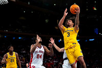 Morez Johnson Jr. (21) and Elliot Cadeau (3)