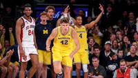 Will Tschetter (42) and Michigan Team