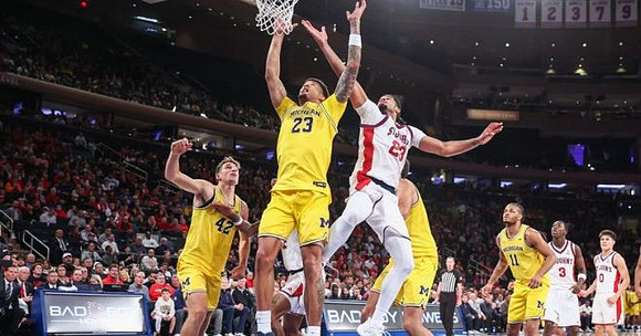 Will Tschetter (42), Yaxel Lendeborg (23), and Roddy Gayle Jr. (11)