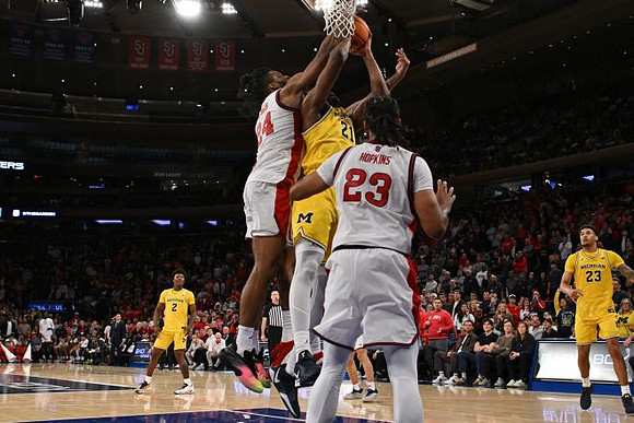 L.J. Cason (2), Morez Johnson Jr. (21), and Yaxel Lendeborg (23)