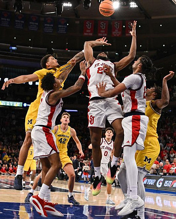 Yaxel Lendeborg (23), Elliot Cadeau (3), Will Tschetter (42), and Morez Johnson Jr. (21)