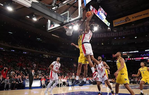 Yaxel Lendeborg (23), Morez Johnson Jr. (21), and Trey McKenney (1)