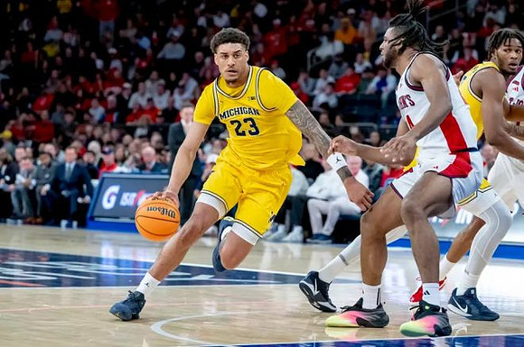 Yaxel Lendeborg (23) and Morez Johnson Jr. (21)