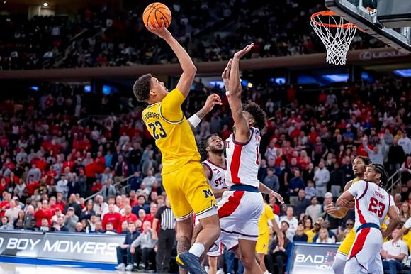 Yaxel Lendeborg (23) and Morez Johnson Jr. (21)