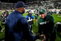 Sherrone Moore and Michigan State Head Coach Jonathan Smith