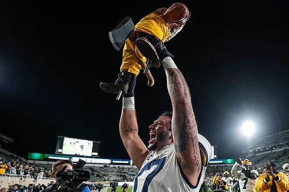 Marlin Klein (17) and Paul Bunyan Trophy