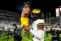 Semaj Morgan (0) and Paul Bunyan Trophy