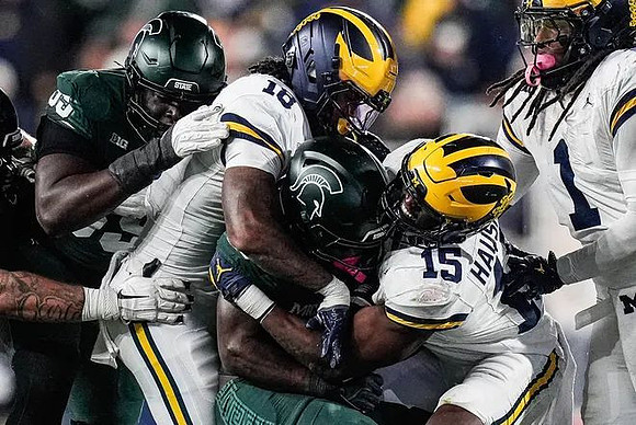 Troy Bowles (18), Ernest Hausmann (15), and Jaishawn Barham (1)