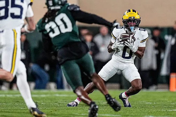 Logan Forbes (85) and Semaj Morgan (0)