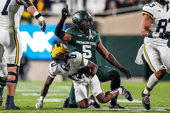 Blake Frazier (77), Semaj Morgan (0), and Zack Marshall (83)