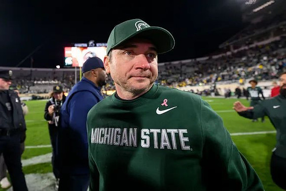 Sherrone Moore and Michigan State Head Coach Jonathan Smith