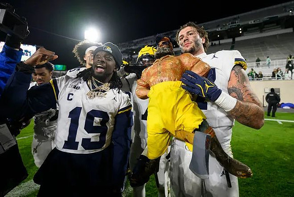 Rod Moore (19), Marlin Klein (17), and Paul Bunyan Trophy