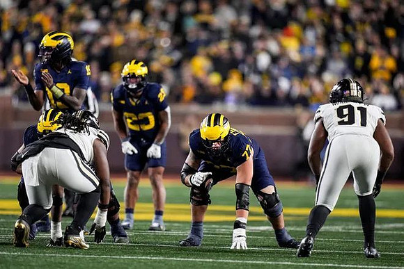 Bryce Underwood (19), Jordan Marshall (23), and Blake Frazier (77)