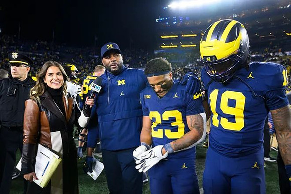 Sherrone Moore, Jordan Marshall (23), and Bryce Underwood (19)