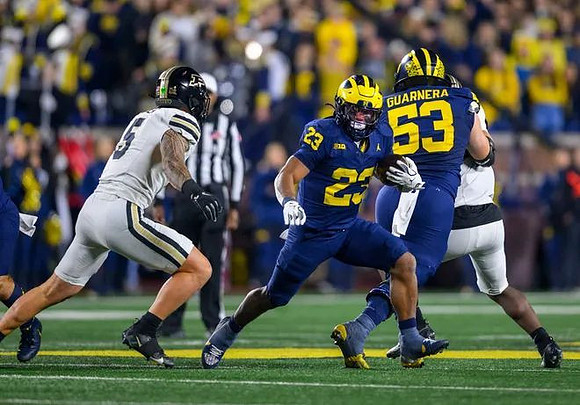 Jordan Marshall (23) and Jake Guarnera (53)