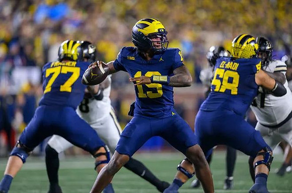 Blake Frazier (77), Bryce Underwood (19), and Giovanni El-Hadi (58)