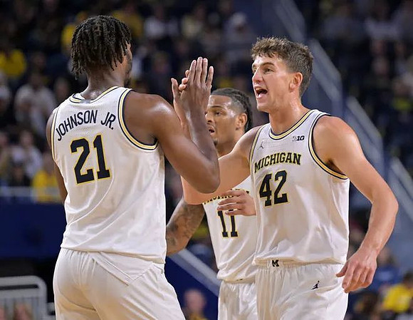 Morez Johnson Jr. (21), Roddy Gayle Jr. (11), and Will Tschetter (42)