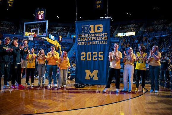 Michigan Team and 2025 Big Ten Tournament Championship Banner