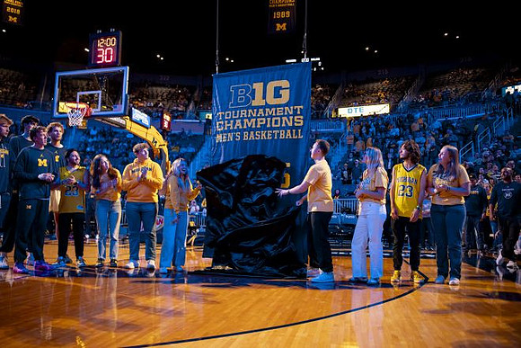 Michigan Team and 2025 Big Ten Tournament Championship Banner