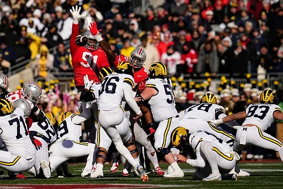Dominic Zvada (96), Tommy Doman (19), and Michigan Team