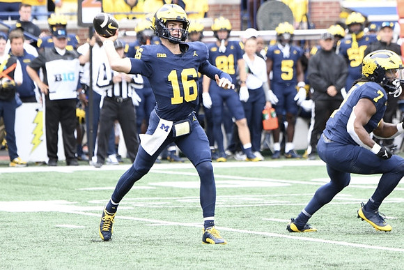 Davis Warren (16) and Donovan Edwards (7)