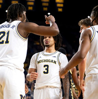 Morez Johnson Jr. (21), Elliot Cadeau (3), Trey McKenney (1), and Will Tschetter (42)