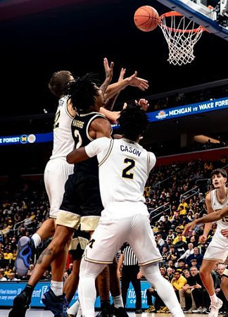 Will Tschetter (42), L.J. Cason (2), and Aday Mara (15)