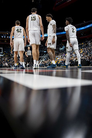 Will Tschetter (42), Aday Mara (15), Yaxel Lendeborg (23), and L.J. Cason (2)