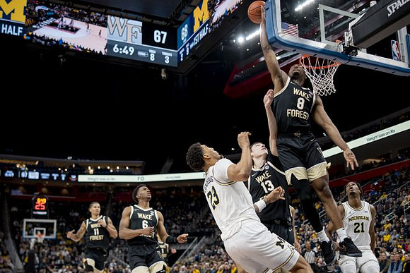Yaxel Lendeborg (23) and Morez Johnson Jr. (21)