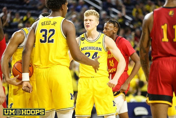 Tarris Reed Jr. (32) and Youssef Khayat (24)