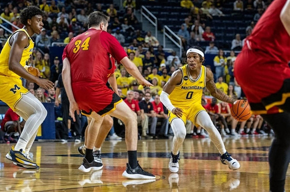 Tarris Reed Jr. (32) and Dug McDaniel (0)